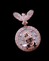 A rose gold pendant featuring an owl at the top and a circular medallion with a portrait of Pablo Escobar surrounded by pavé stones, set against a solid black background.