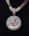 A rose gold chain necklace featuring a large oval pendant and a matching bird-shaped pendant, both heavily embellished with clear rhinestones, set against a solid black background.