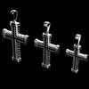 Three silver cross pendants with textured, ribbed details and looped bail tops, displayed against a solid black background.